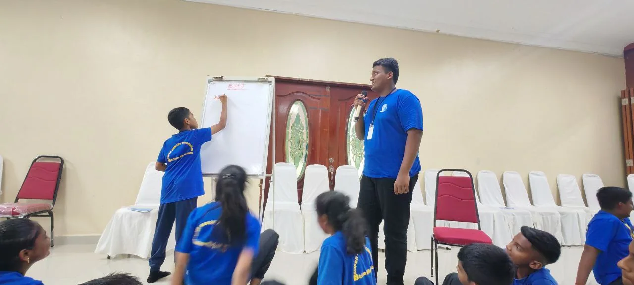 A student taking part in a holiday camp activity